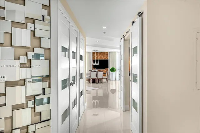 a view of kitchen with kitchen island stainless steel appliances