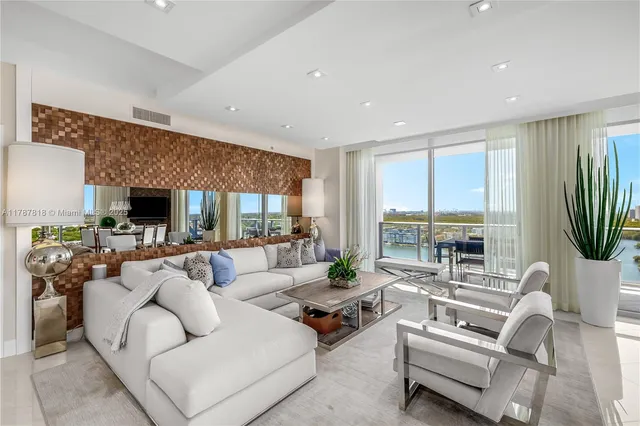 a living room with fireplace furniture and a rug