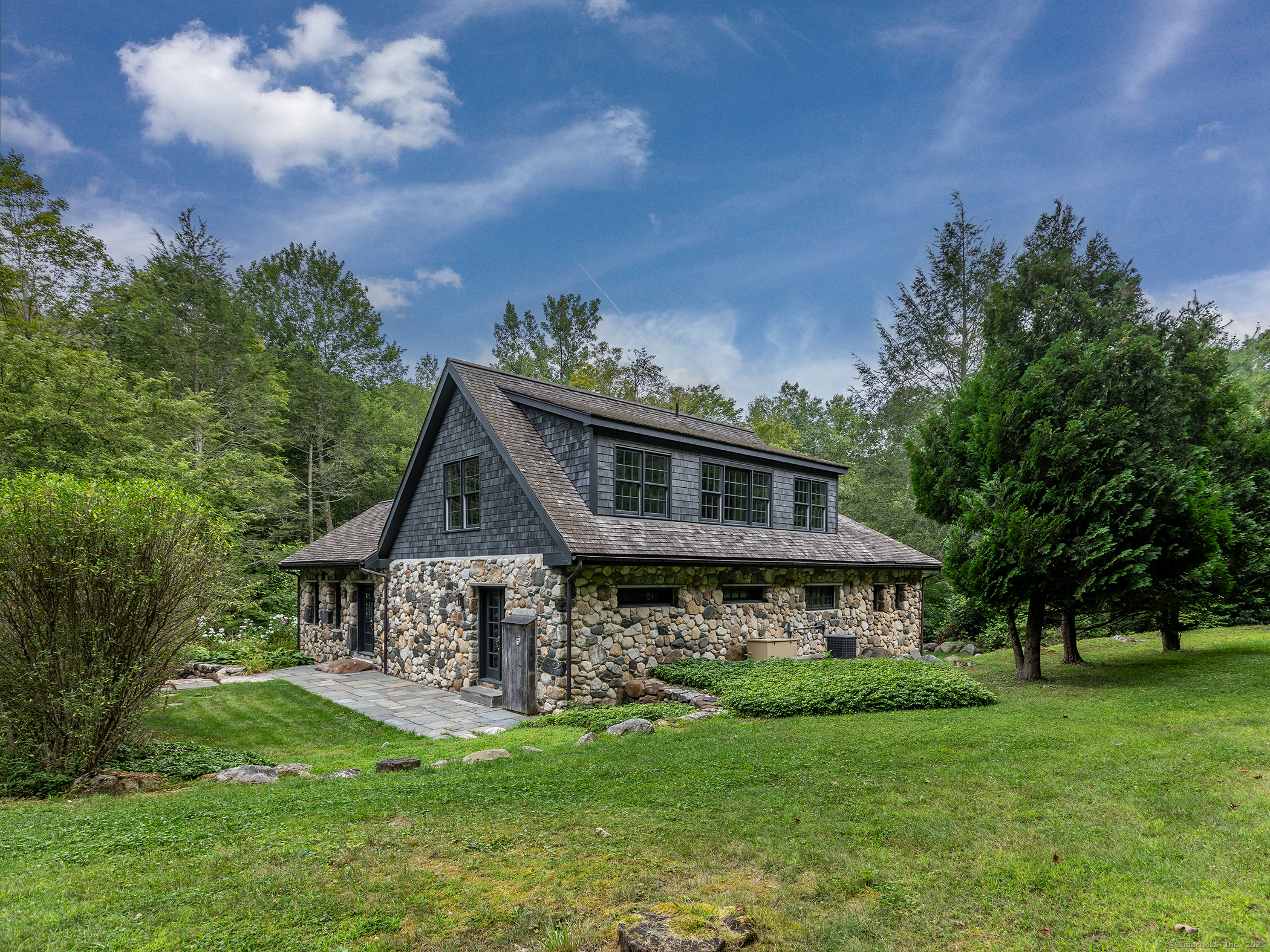 337 Romford Road Washington, CT 06777 - Photo 3 of 38 a front view of a house with a garden