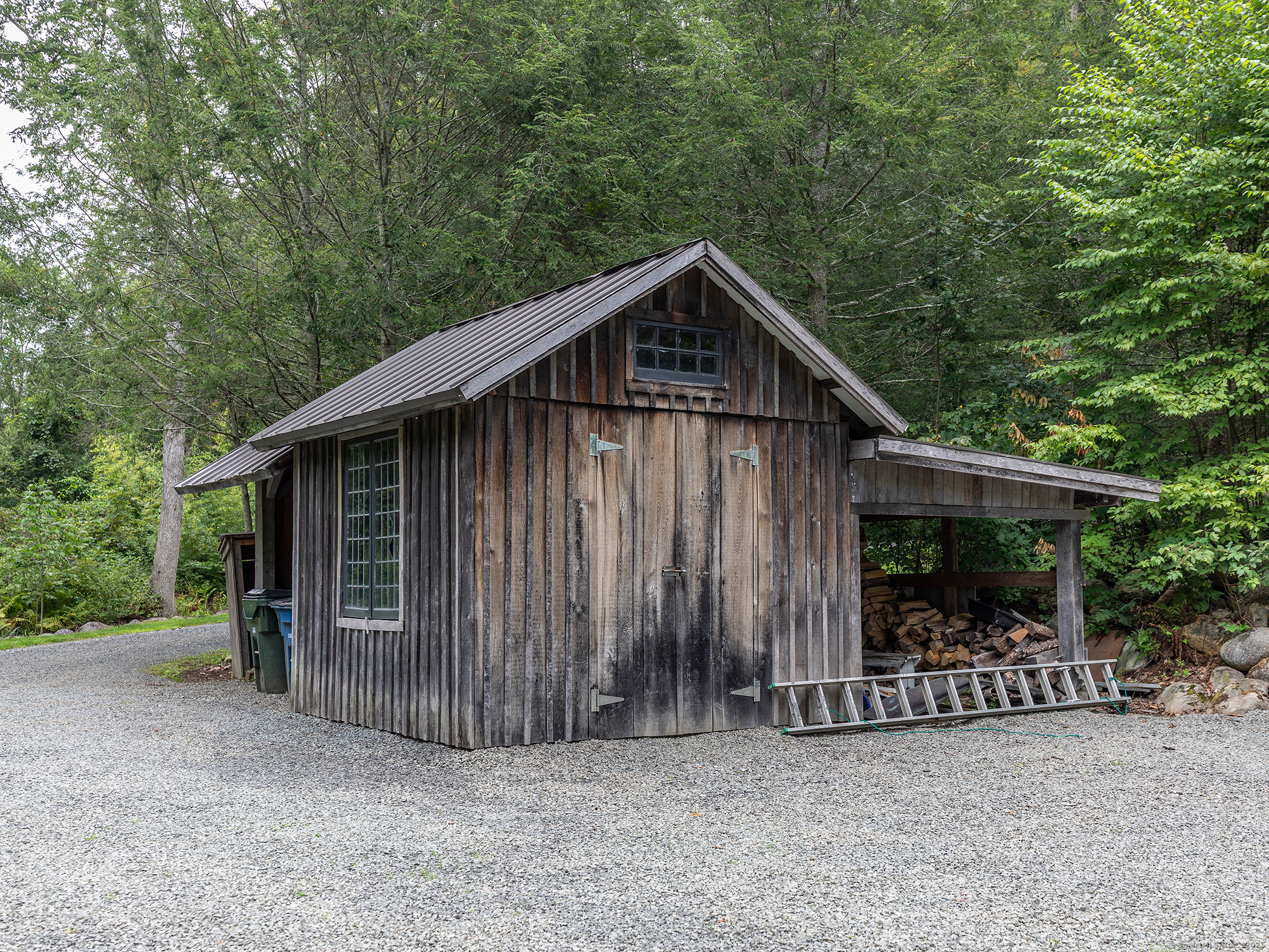 337 Romford Road Washington, CT 06777 - Photo 36 of 38 a view of a house with a small yard and a large tree
