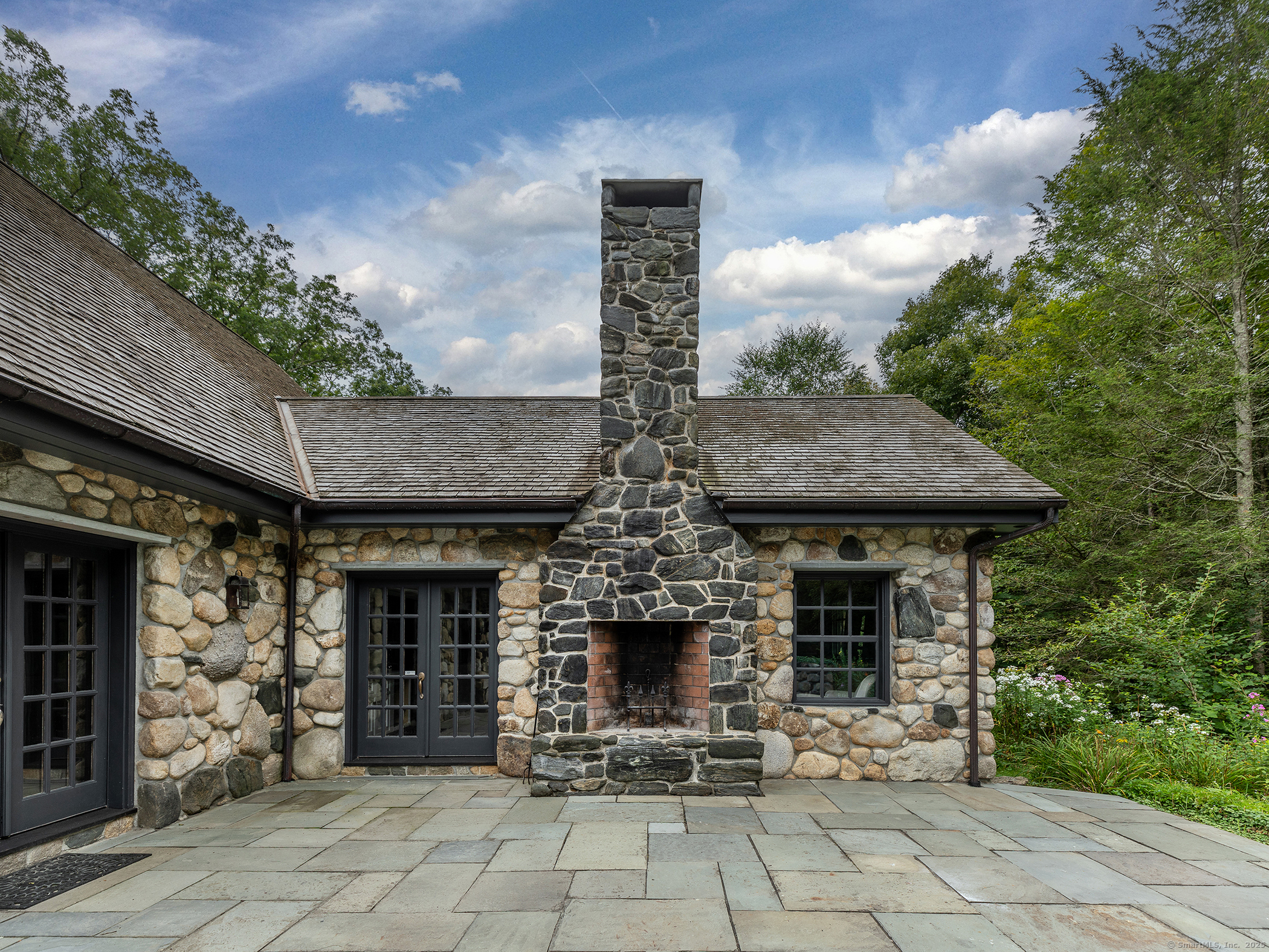 337 Romford Road Washington, CT 06777 - Photo 8 of 38 a front view of a building with garden