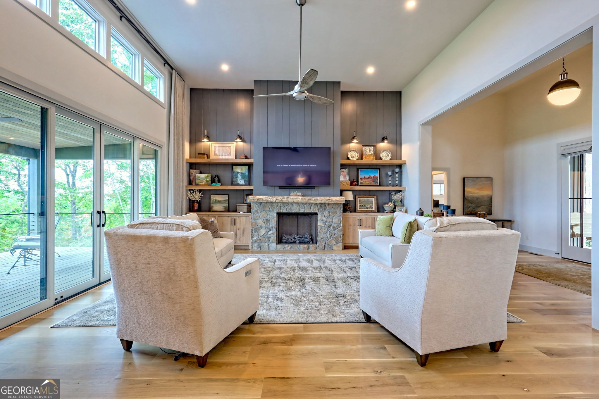 1095 Rabun Bluffs Drive Lakemont, GA 30552 - Photo 16 of 57 a living room with furniture a fireplace and a large window