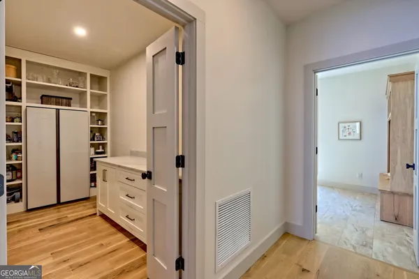 a kitchen with stainless steel appliances granite countertop a stove and a refrigerator