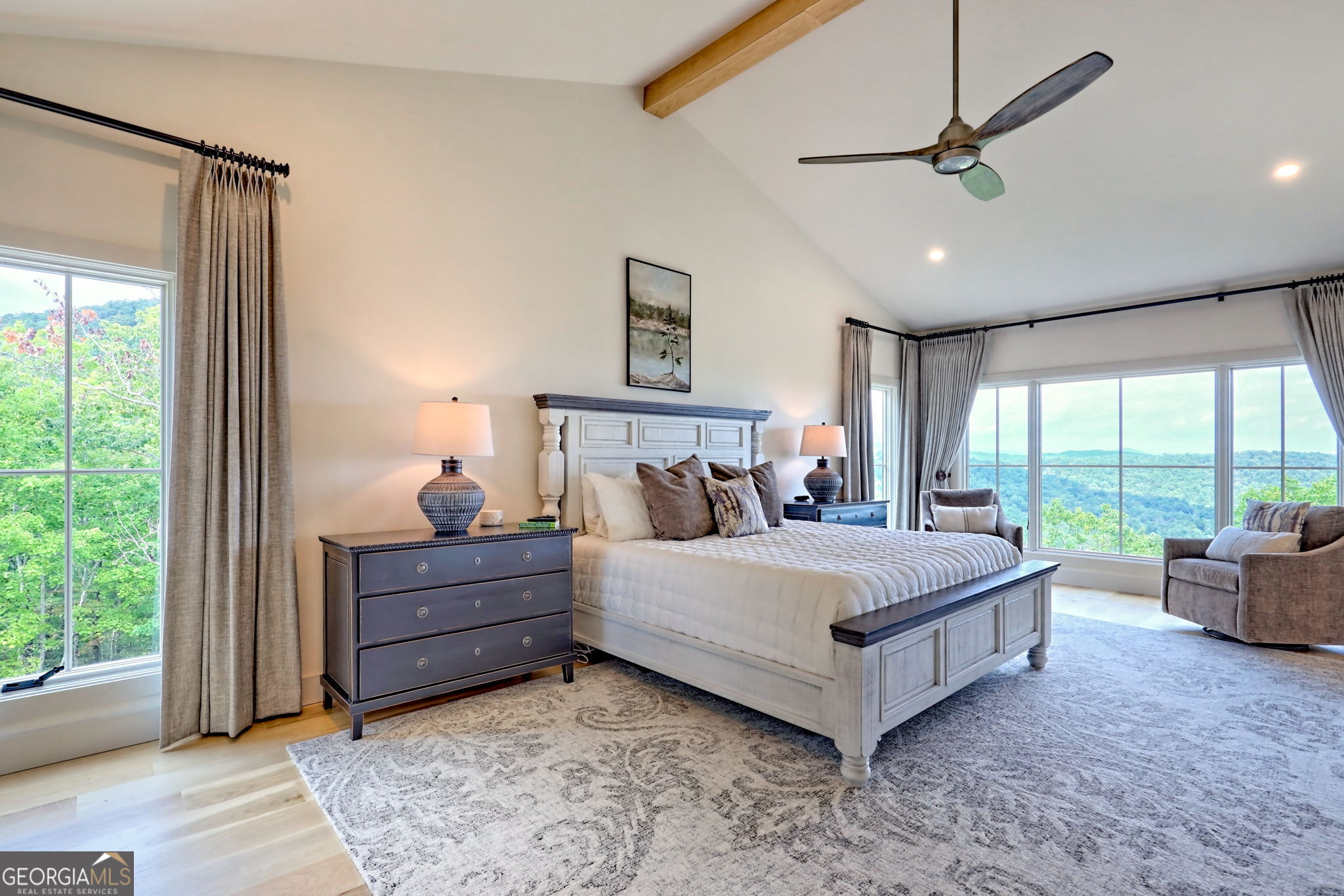 1095 Rabun Bluffs Drive Lakemont, GA 30552 - Photo 26 of 57 a bed sitting in a spacious bedroom next to a window