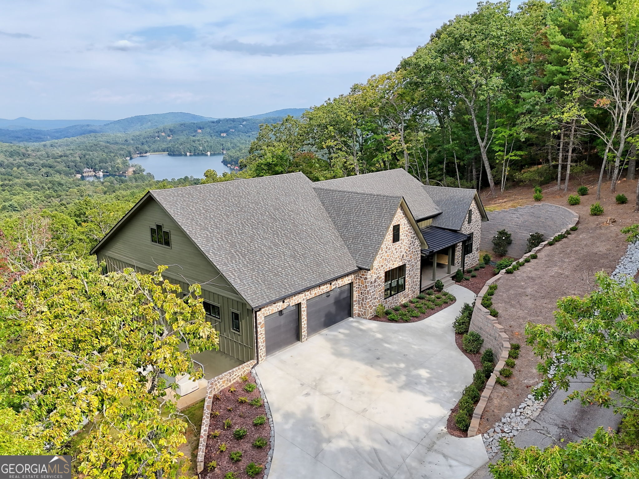 1095 Rabun Bluffs Drive Lakemont, GA 30552 - Photo 3 of 57 an aerial view of a house with yard and mountain view in back