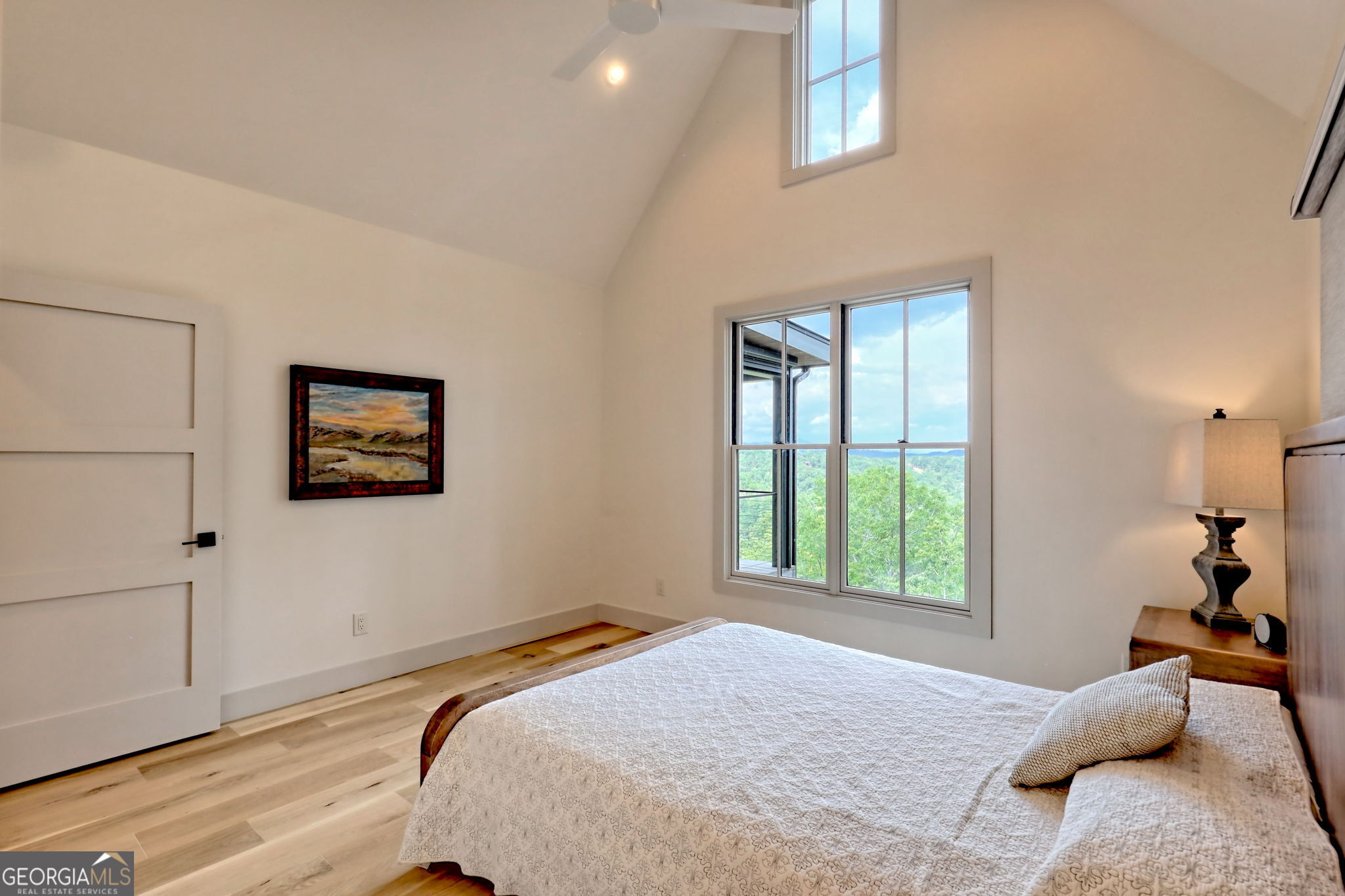 1095 Rabun Bluffs Drive Lakemont, GA 30552 - Photo 37 of 57 a bedroom with a bed and a window