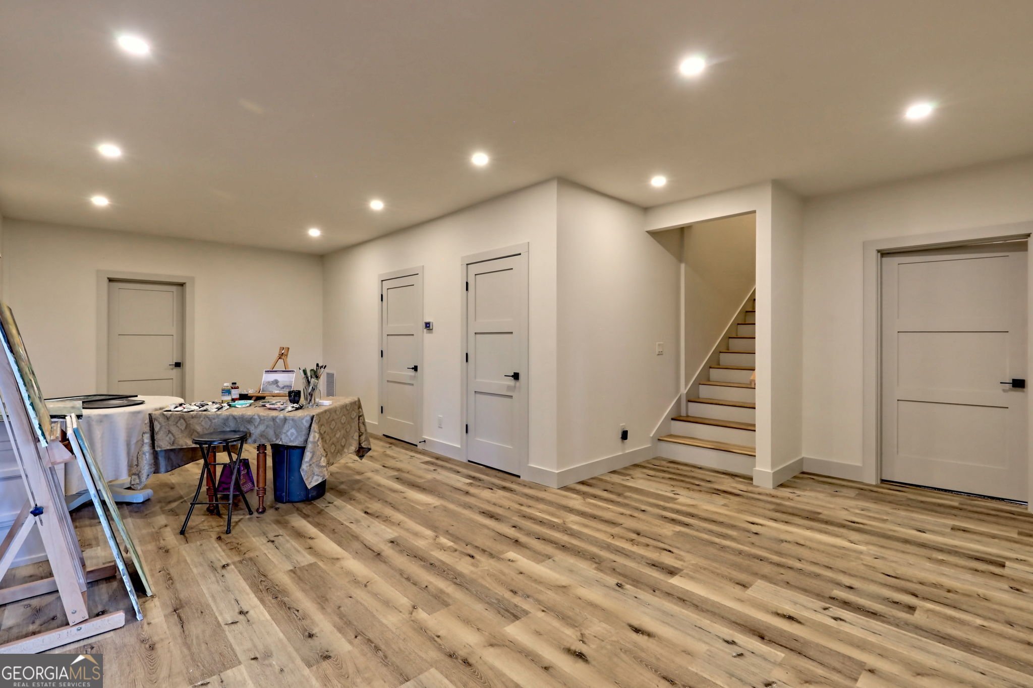 1095 Rabun Bluffs Drive Lakemont, GA 30552 - Photo 45 of 57 a view of a room with wooden floor stairs and windows