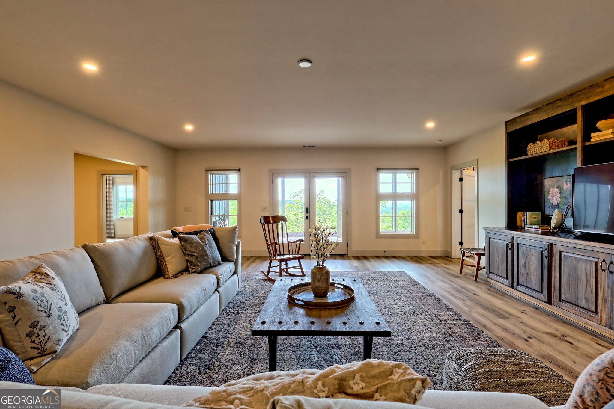 1095 Rabun Bluffs Drive Lakemont, GA 30552 - Photo 48 of 57 a living room with furniture a rug and a large window
