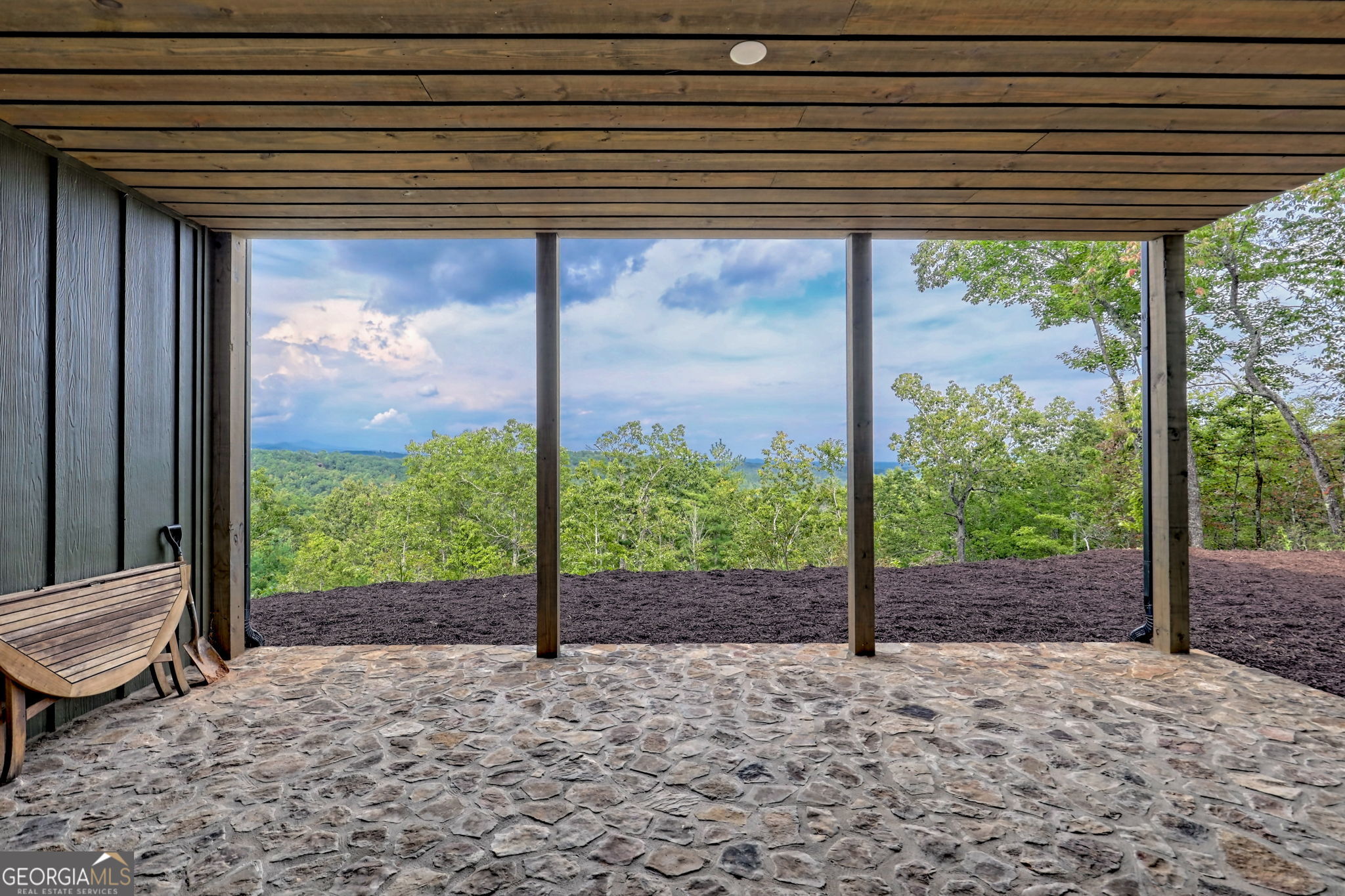 1095 Rabun Bluffs Drive Lakemont, GA 30552 - Photo 51 of 57 a view of a porch with a table chairs and wooden fence