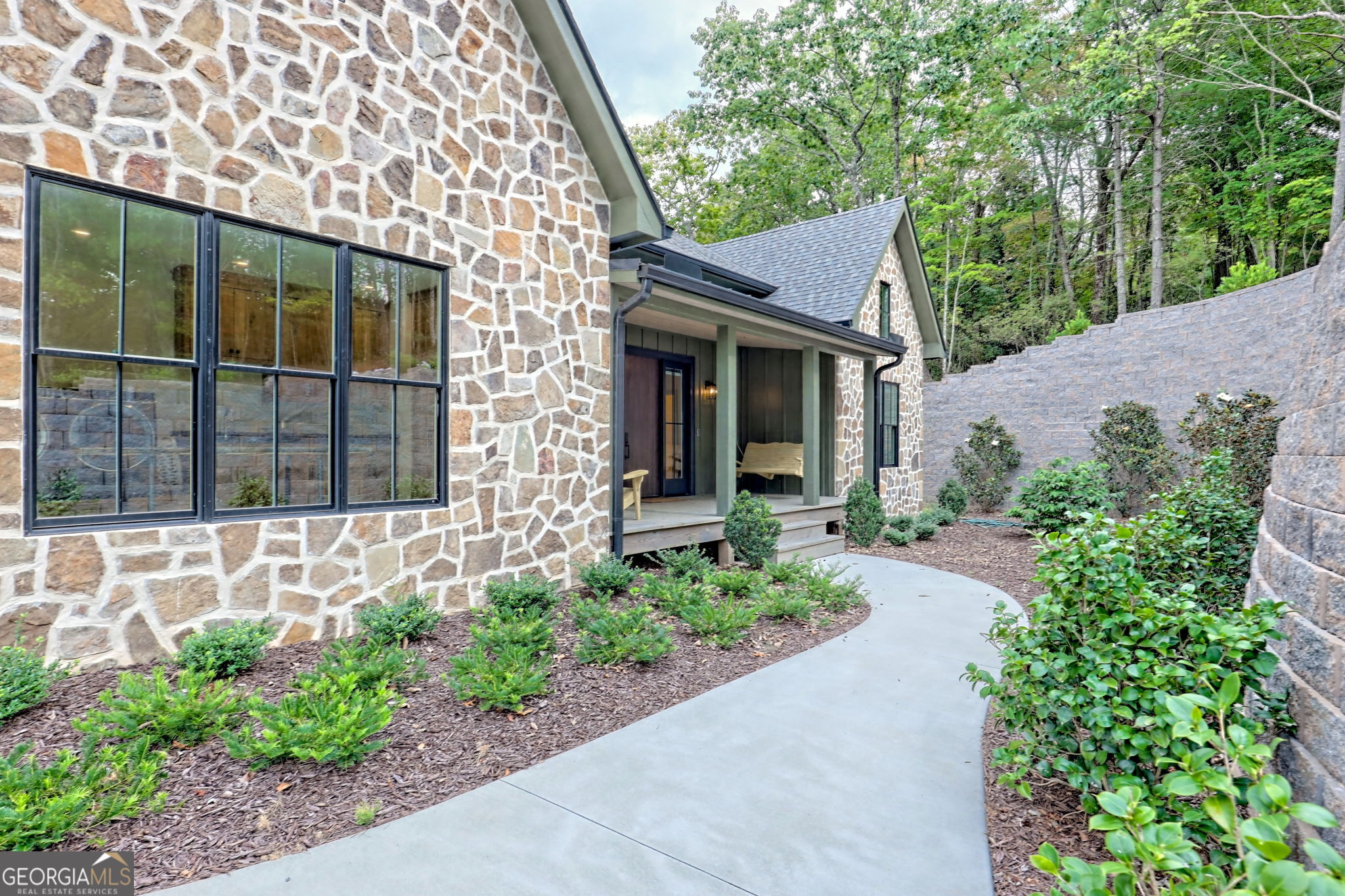 1095 Rabun Bluffs Drive Lakemont, GA 30552 - Photo 8 of 57 a front view of a house with garden