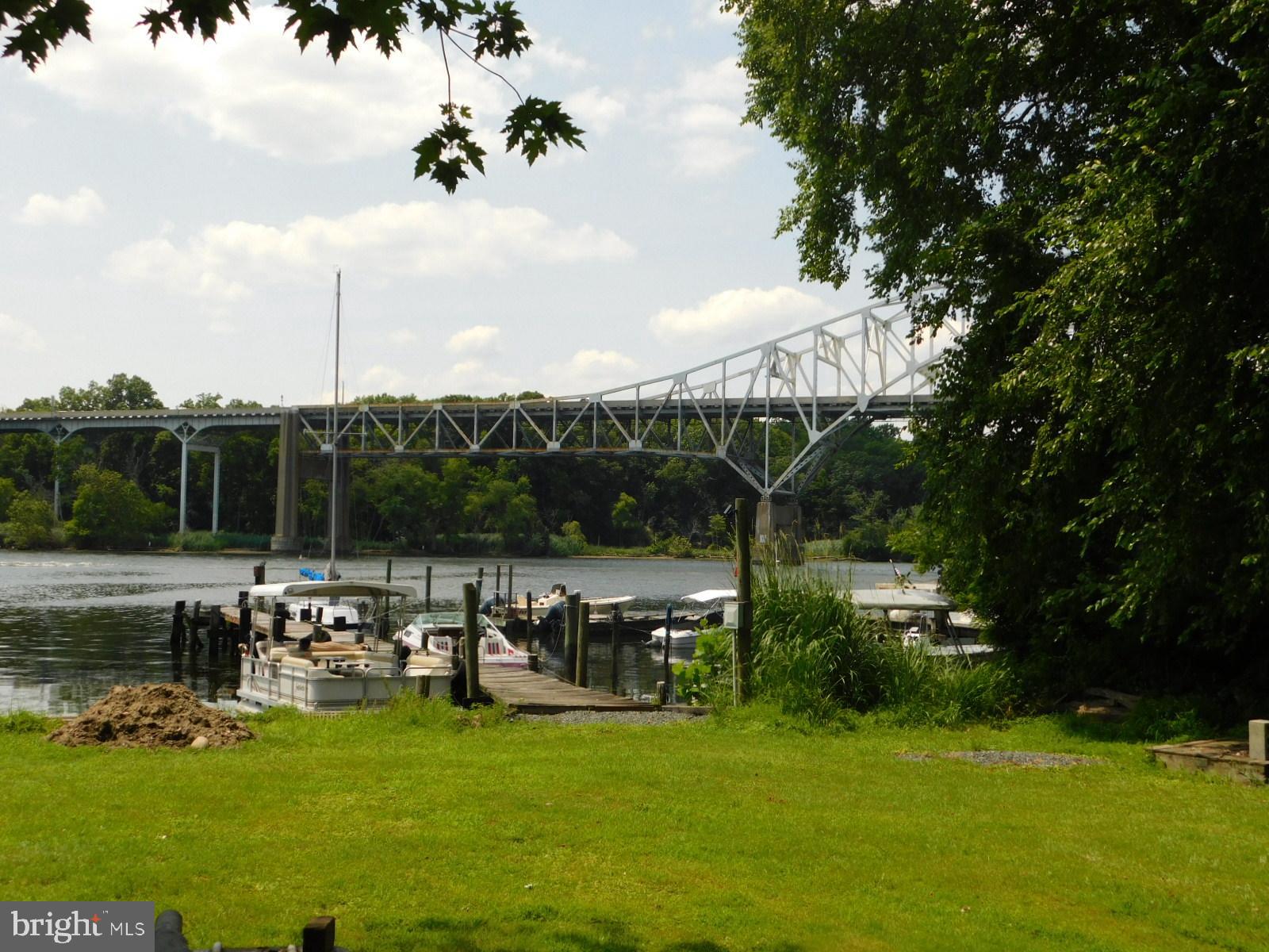 41 River Road Perryville, MD 21903 - Photo 23 of 26 a view of a lake with a bench and trees