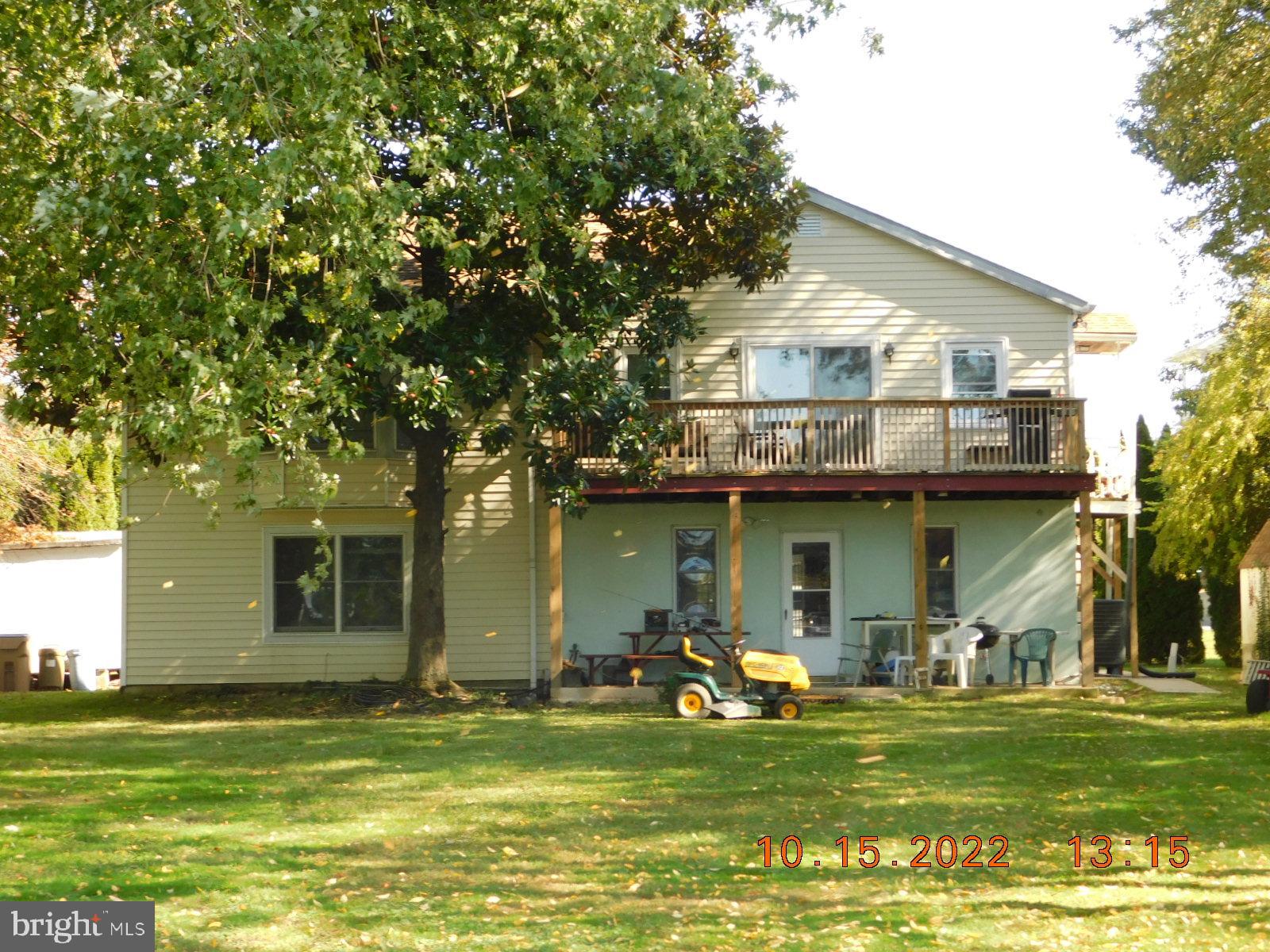 41 River Road Perryville, MD 21903 - Photo 7 of 26 a front view of a house with a garden and trees