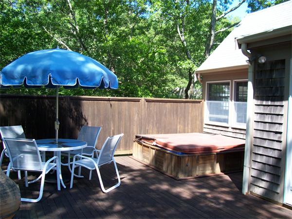 9 Hanson Lane Barnstable, MA 02630 - Photo 18 of 23 a patio with table and chairs