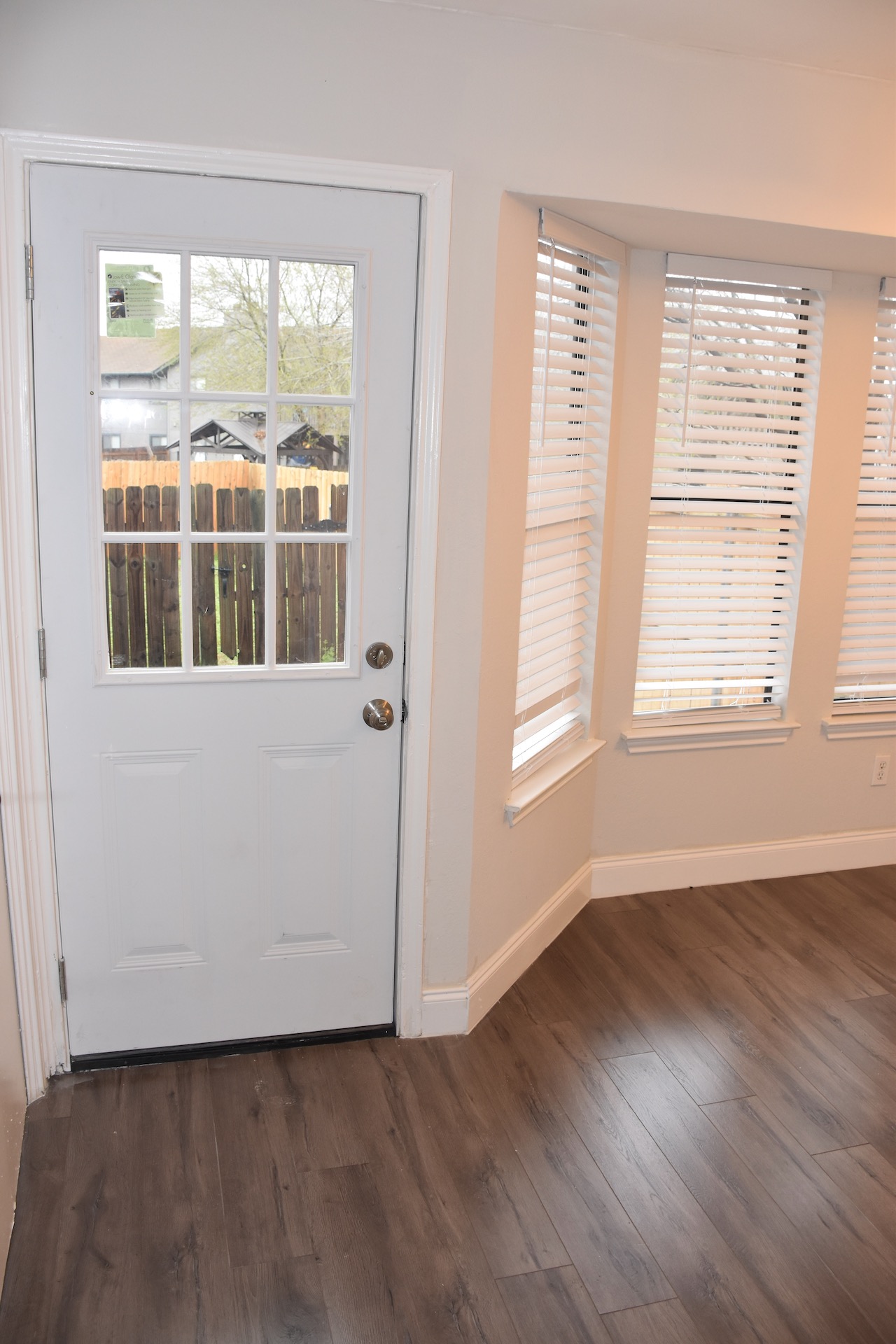 1810 Rawhide Loop Round Rock, TX 78681 - Photo 17 of 29 Wood-finish flooring throughout, complemented by a multi-pane glass panel door with a brass doorknob