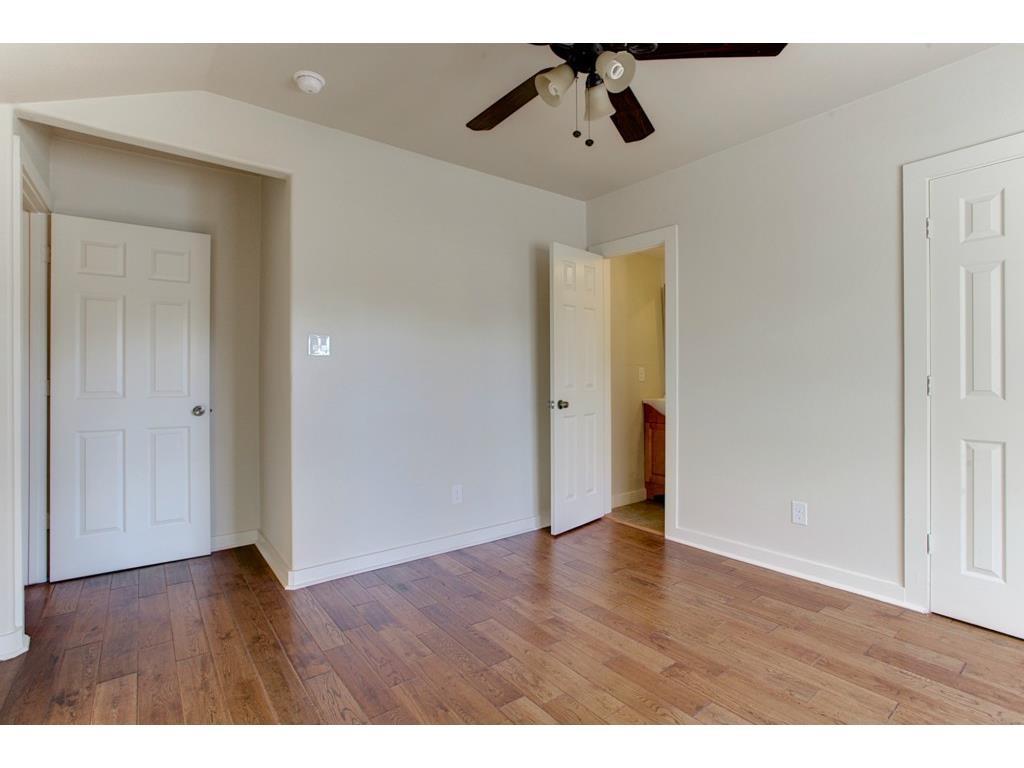 2103 Harrison Avenue Fort Worth, TX 76110 - Photo 15 of 19 a view of an empty room with wooden floor