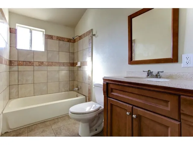 a bathroom with a sink vanity and a mirror