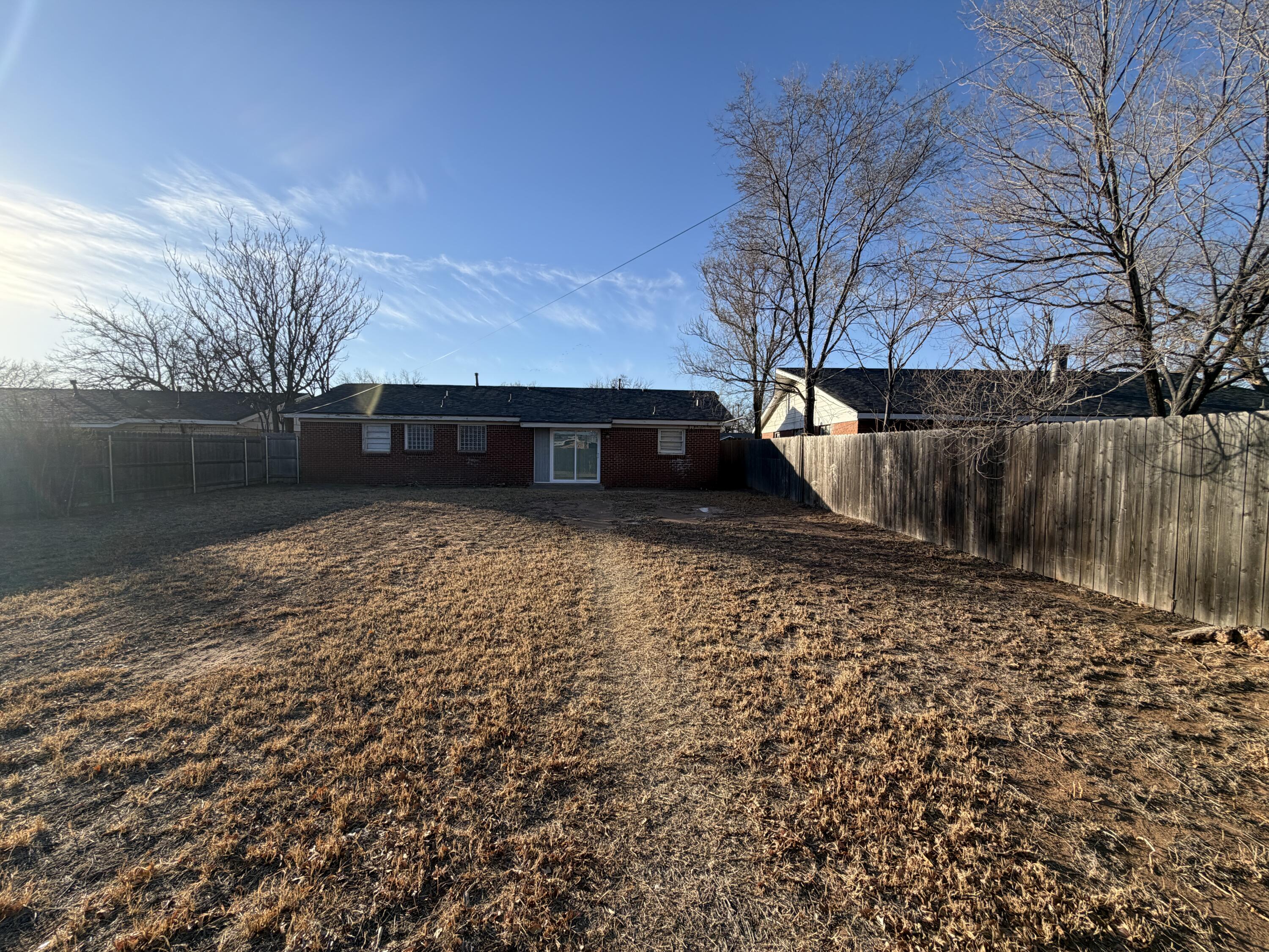 5114 46th Street Lubbock, TX 79414 - Photo 16 of 16 a view of a house with a yard