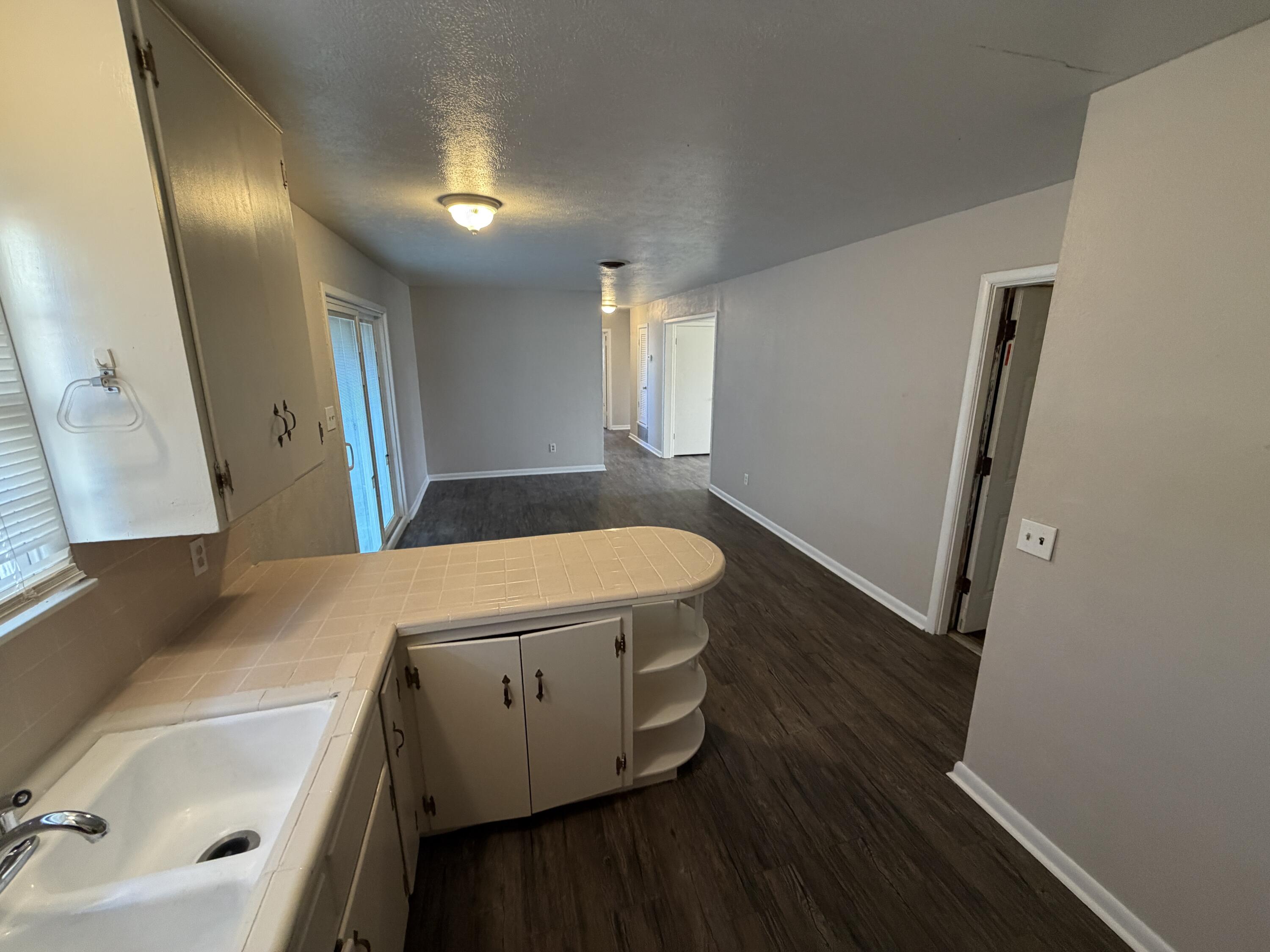 5114 46th Street Lubbock, TX 79414 - Photo 5 of 16 a bathroom with a sink and a mirror