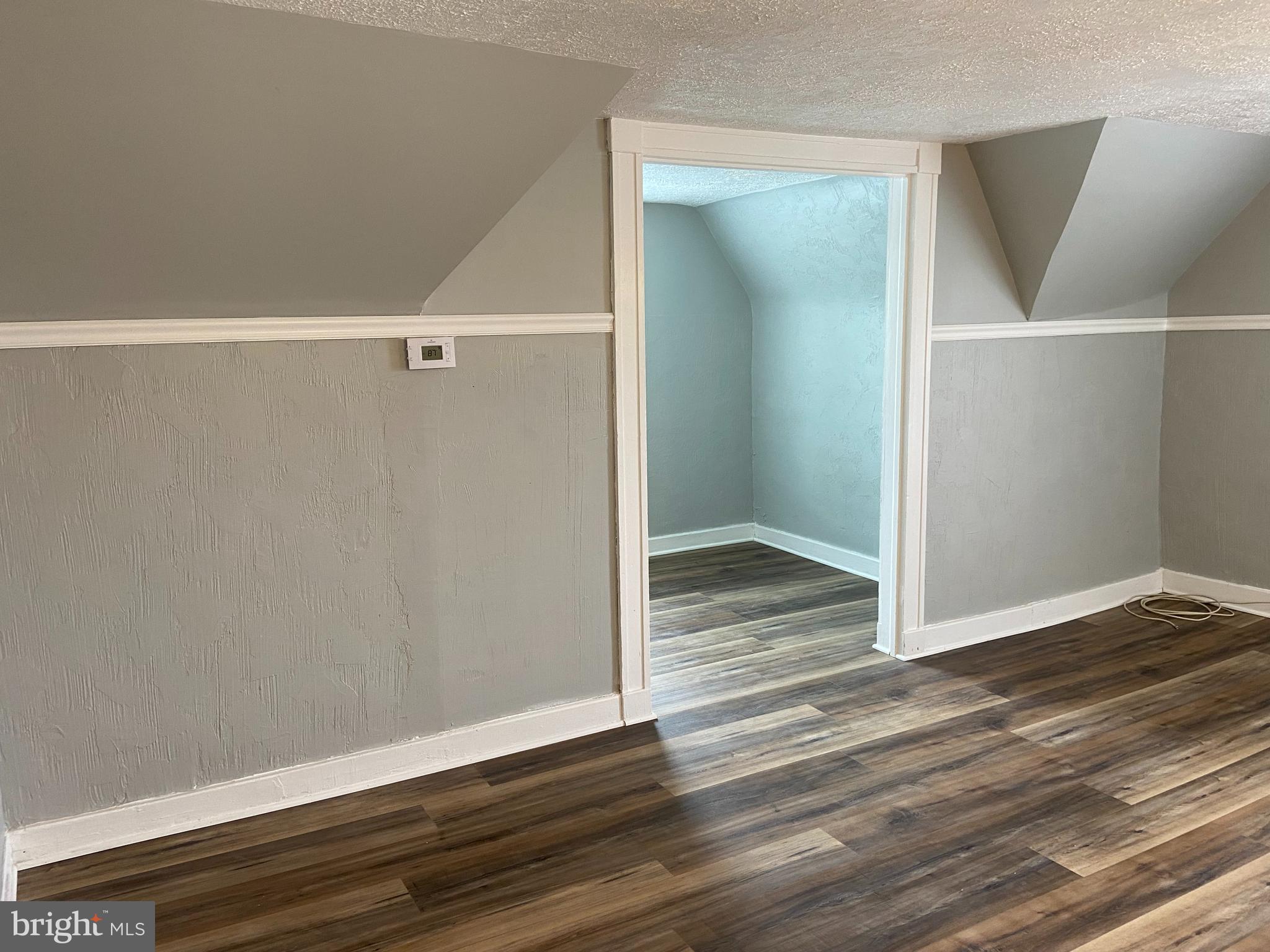 3414 Garrison Boulevard, Unit 3 Baltimore, MD 21215 - Photo 5 of 12 a view of room with wooden floor