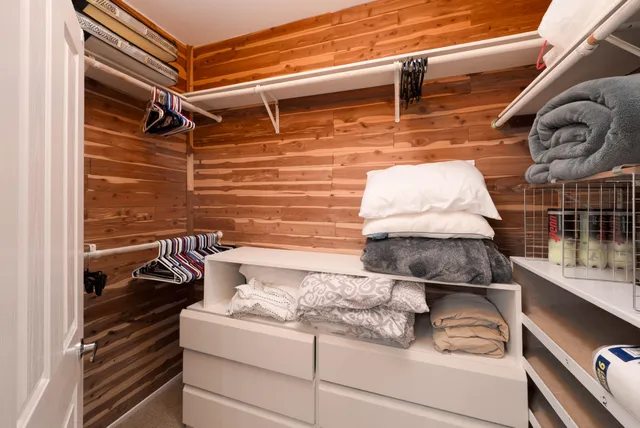 a bedroom with bed and a window