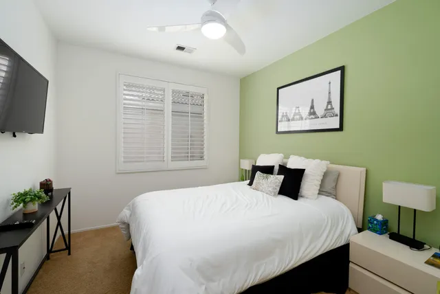 a bathroom with a sink a toilet and shower curtain