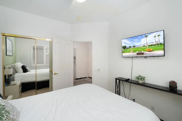 a view of a patio with a table & chairs