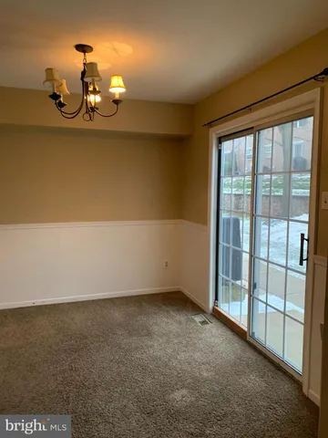 a view of an empty room with a fireplace