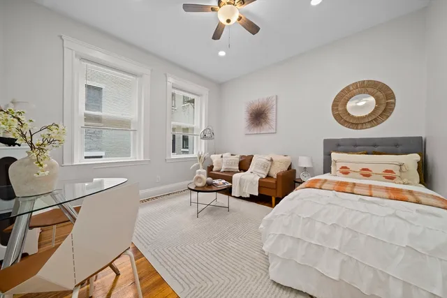 a bedroom with bed and window