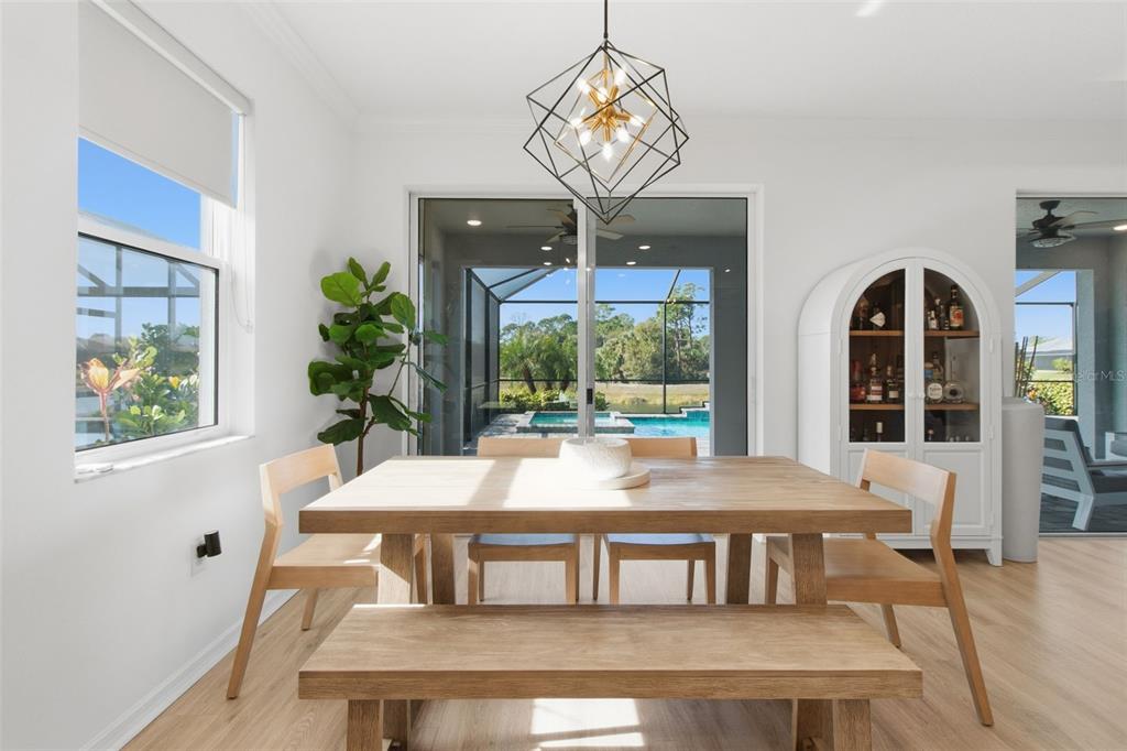 19912 Bridgetown Loop Venice, FL 34293 - Photo 11 of 49 a view of a dining room with furniture window and outside view
