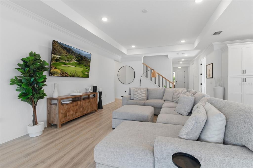 19912 Bridgetown Loop Venice, FL 34293 - Photo 12 of 49 a living room with furniture a potted plant and a flat screen tv