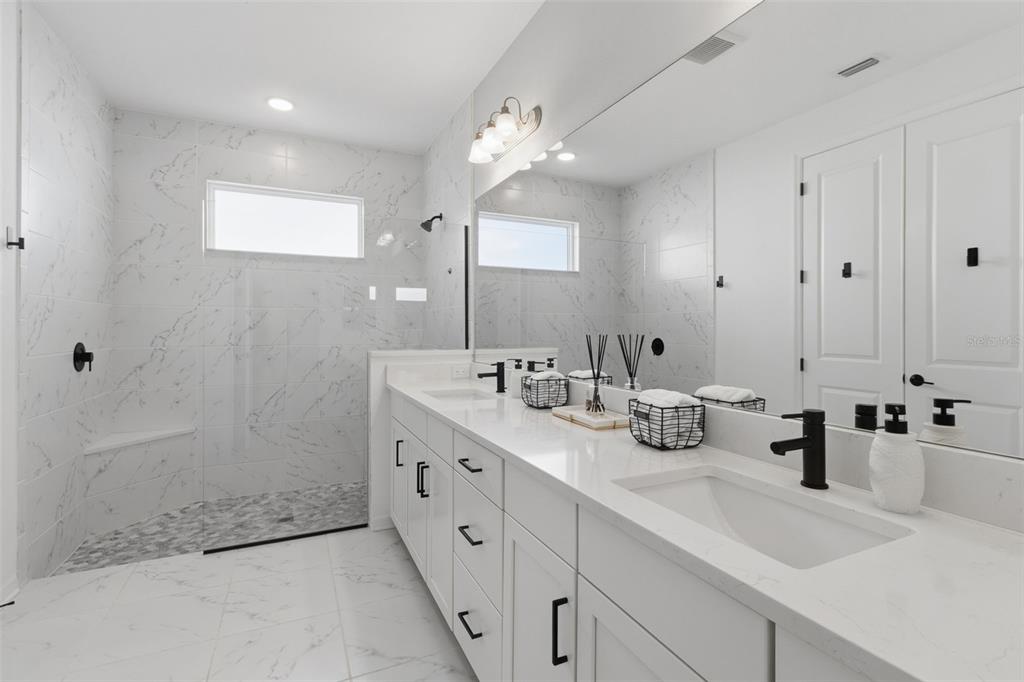 19912 Bridgetown Loop Venice, FL 34293 - Photo 18 of 49 a bathroom with double sink and a mirror