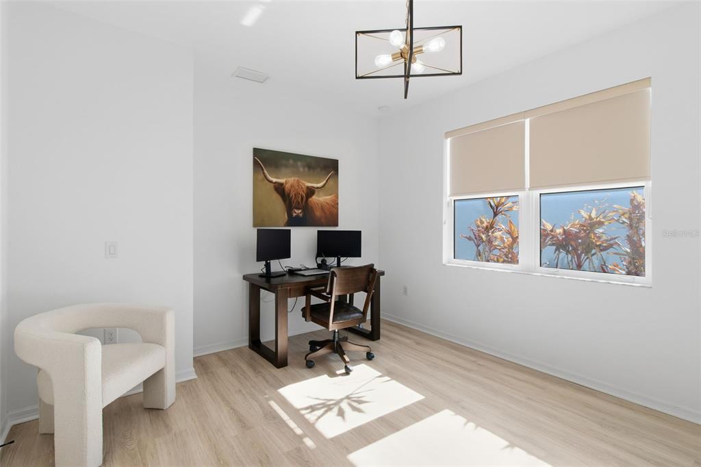 19912 Bridgetown Loop Venice, FL 34293 - Photo 21 of 49 a view of a workspace with furniture and a window