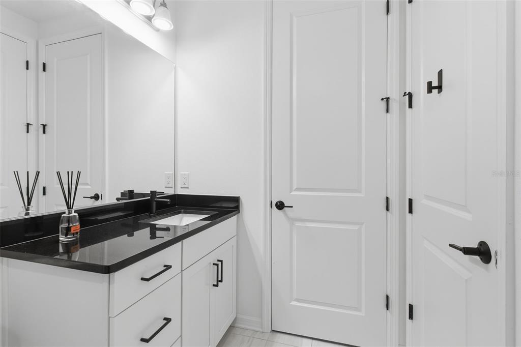 19912 Bridgetown Loop Venice, FL 34293 - Photo 24 of 49 a sink and a mirror