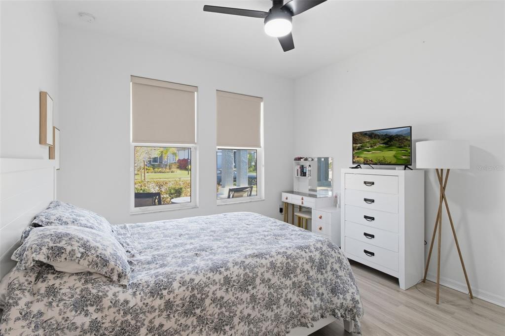 19912 Bridgetown Loop Venice, FL 34293 - Photo 26 of 49 a bedroom with a bed and a dresser