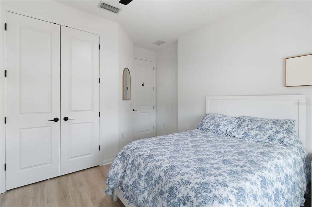 19912 Bridgetown Loop Venice, FL 34293 - Photo 27 of 49 a bedroom with a bed and a cabinet