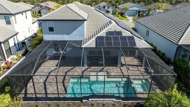 a view of a backyard with sitting area