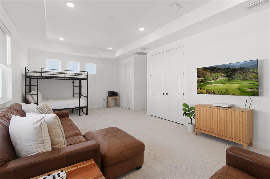 19912 Bridgetown Loop Venice, FL 34293 - Photo 34 of 49 a living room with furniture and a flat screen tv