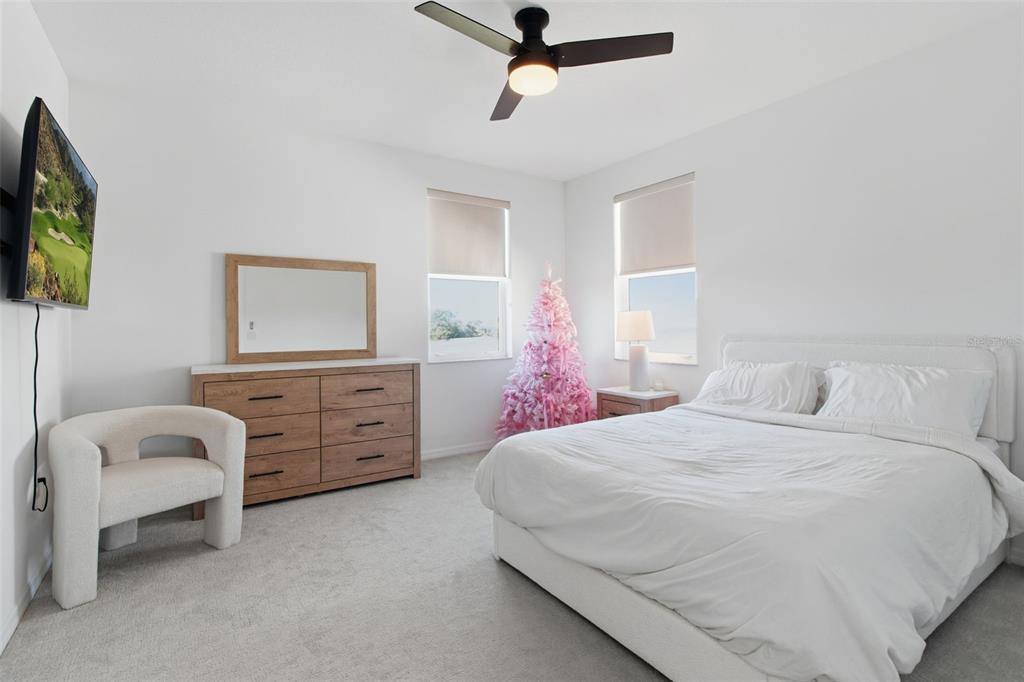 19912 Bridgetown Loop Venice, FL 34293 - Photo 35 of 49 a bedroom with a bed a dresser and couch