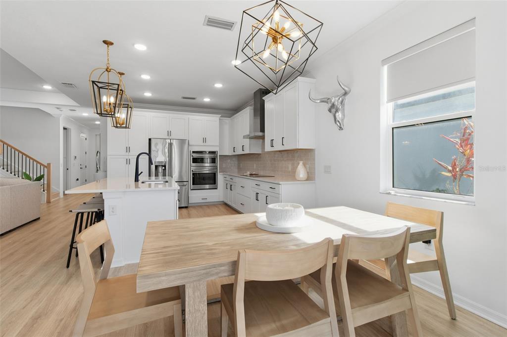 19912 Bridgetown Loop Venice, FL 34293 - Photo 10 of 49 a kitchen with a table and chairs in it