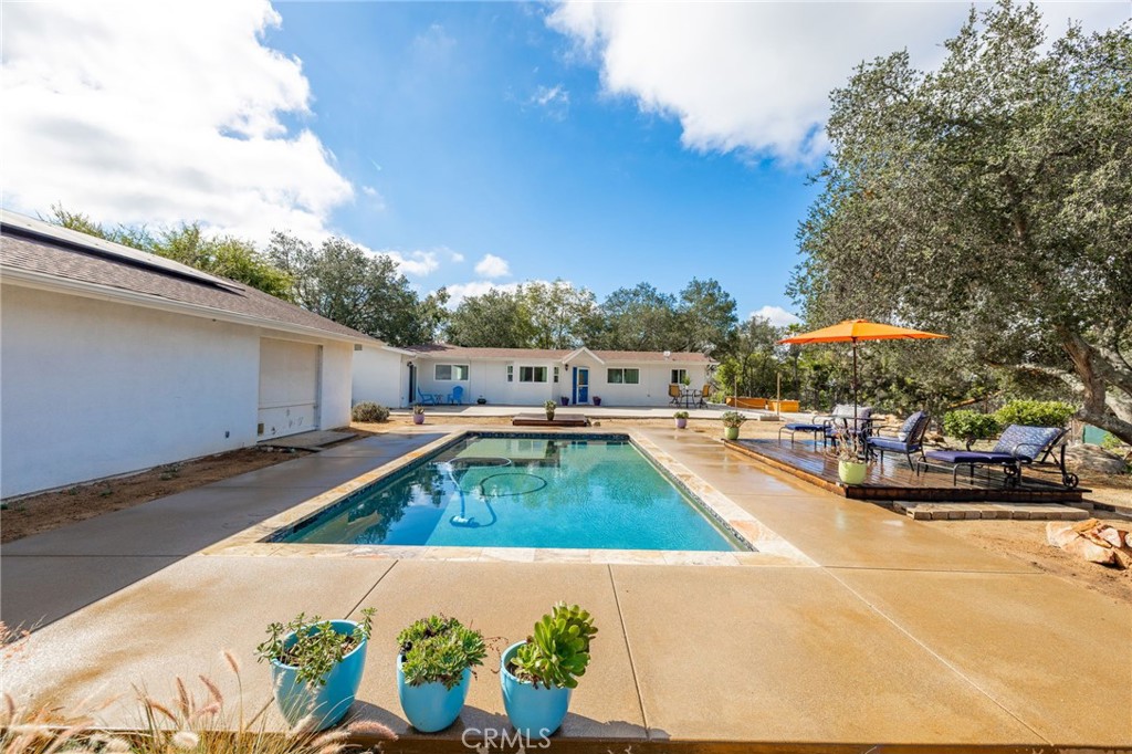 a view of a swimming pool with a lounge chairs