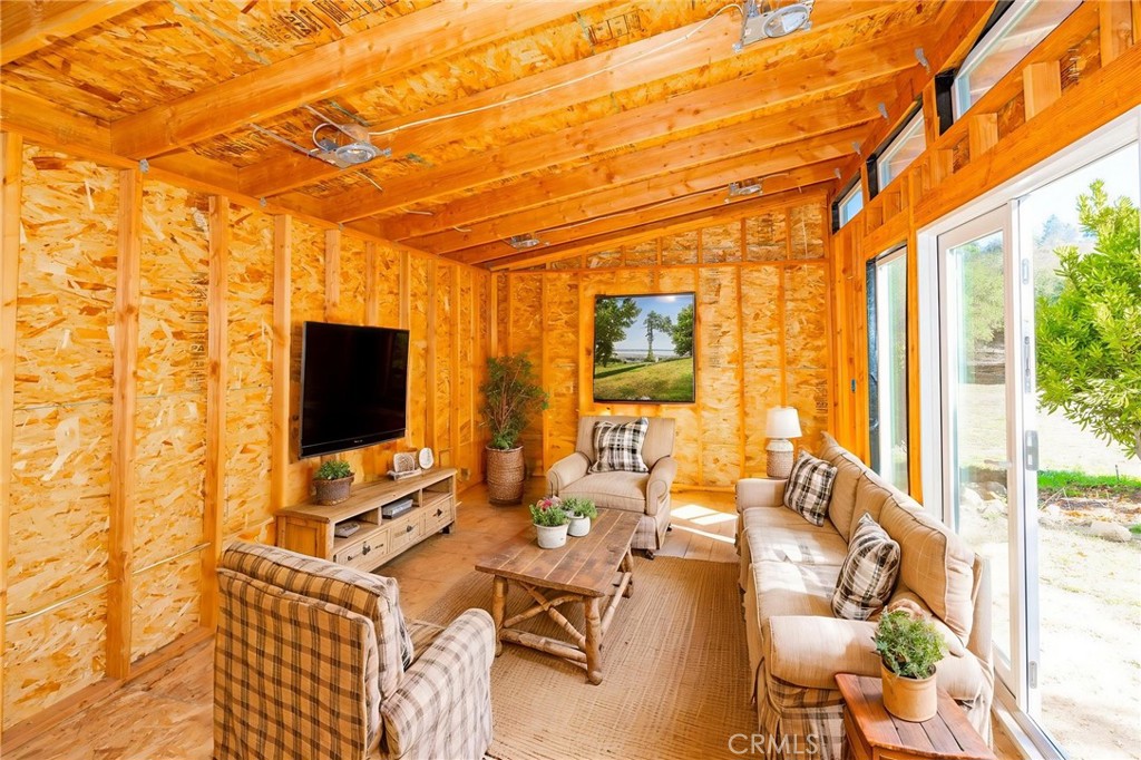 6472 Rainbow Heights Road Rainbow, CA 92028 - Photo 11 of 65 a view of a livingroom with workspace and a window
