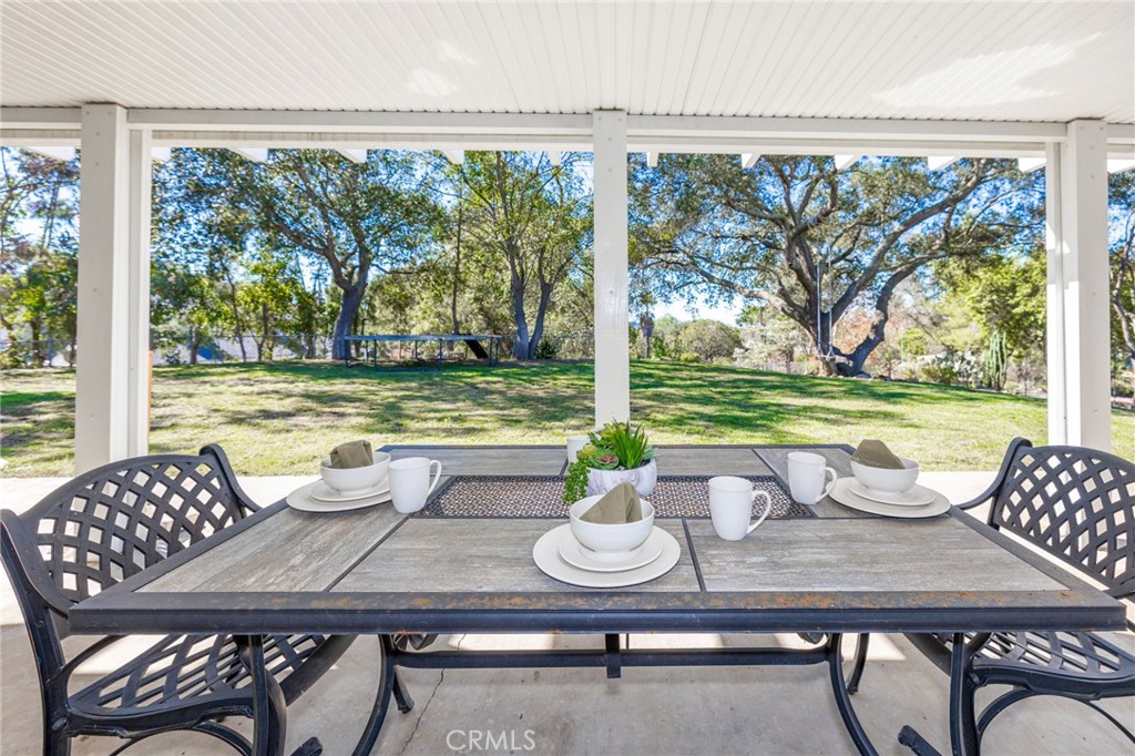 6472 Rainbow Heights Road Rainbow, CA 92028 - Photo 15 of 65 a view of a dining room with furniture window and outside view