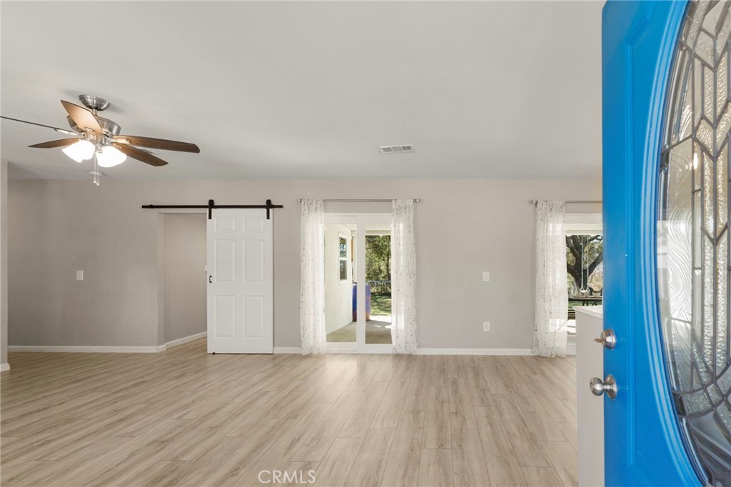 6472 Rainbow Heights Road Rainbow, CA 92028 - Photo 37 of 65 wooden floor in an empty room with a window