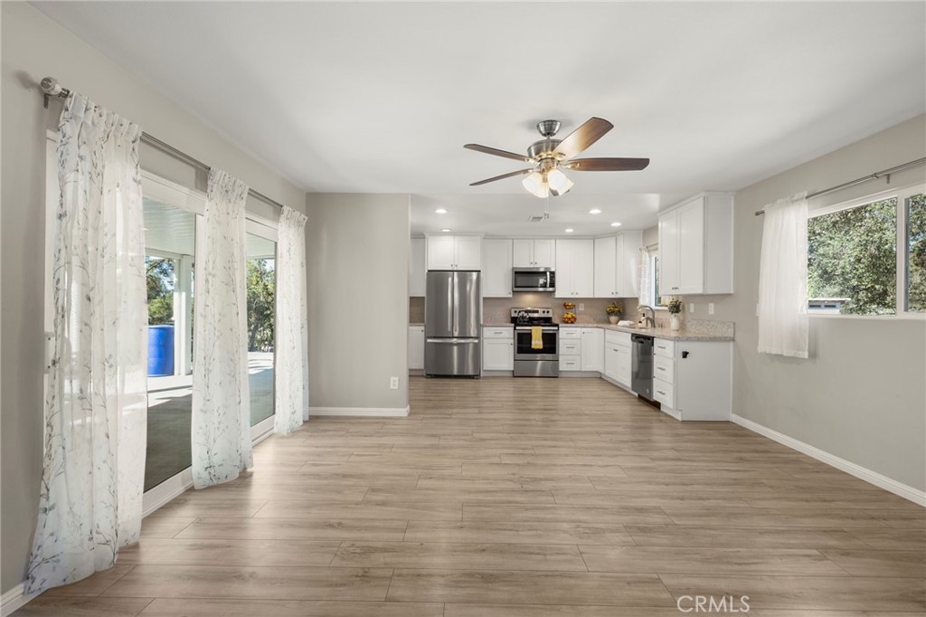 6472 Rainbow Heights Road Rainbow, CA 92028 - Photo 42 of 65 a view of kitchen with furniture and wooden floor