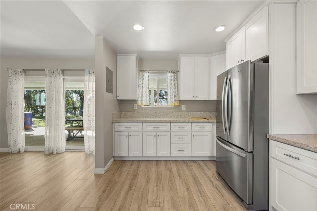 6472 Rainbow Heights Road Rainbow, CA 92028 - Photo 50 of 65 a kitchen with stainless steel appliances a refrigerator sink and cabinets