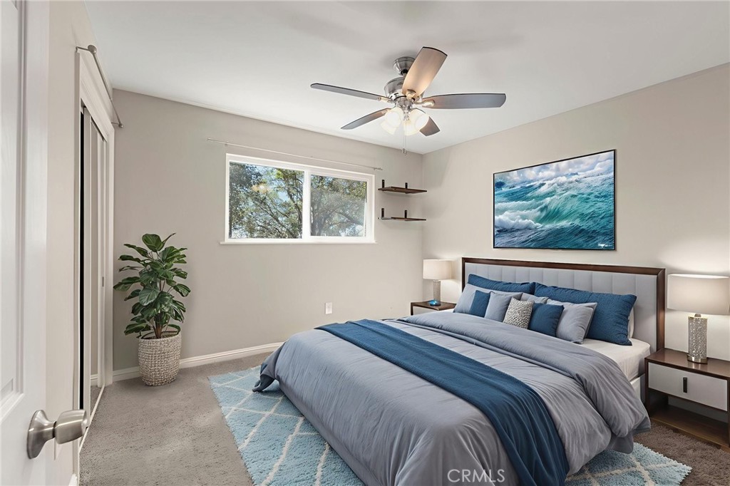 6472 Rainbow Heights Road Rainbow, CA 92028 - Photo 55 of 65 a bedroom with a large bed and a potted plant