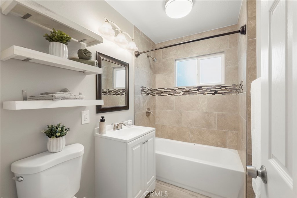 6472 Rainbow Heights Road Rainbow, CA 92028 - Photo 58 of 65 a bathroom with a sink a toilet and shower