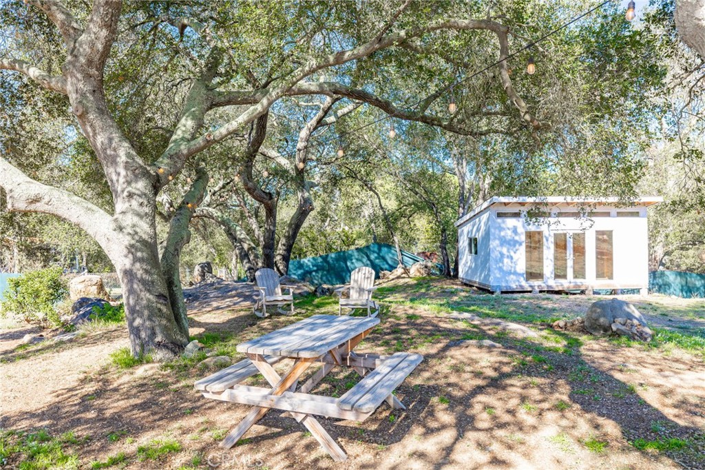 6472 Rainbow Heights Road Rainbow, CA 92028 - Photo 9 of 65 a backyard of a house with barbeque oven table and chairs