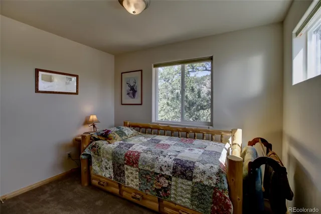 a bathroom with a toilet a sink and a mirror