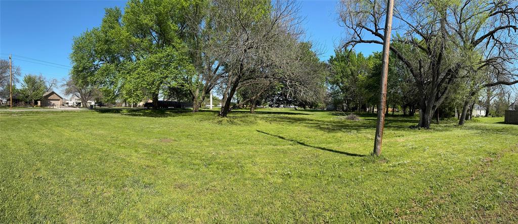 1202 Sherman Street Tioga, TX 76271 - Photo 4 of 6 a view of a park with large trees